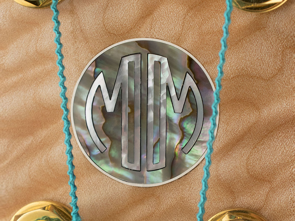 MM monogram in mother of pearl, abalone, and silver
