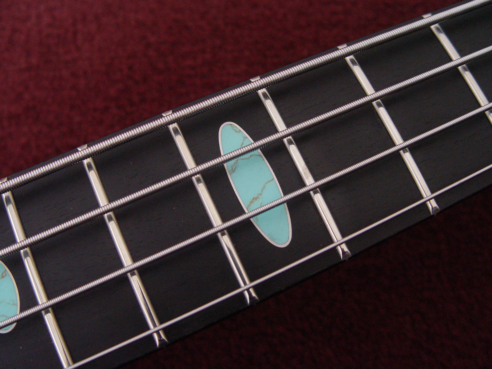 Turquoise recon oval inlay wrapped in silver