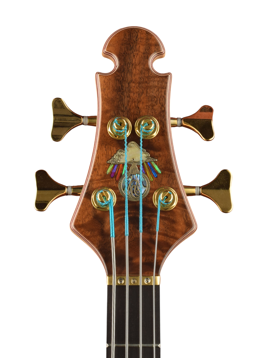 Bronze inlaid logo with golden mother of pearl and abalone plus lab opal rays